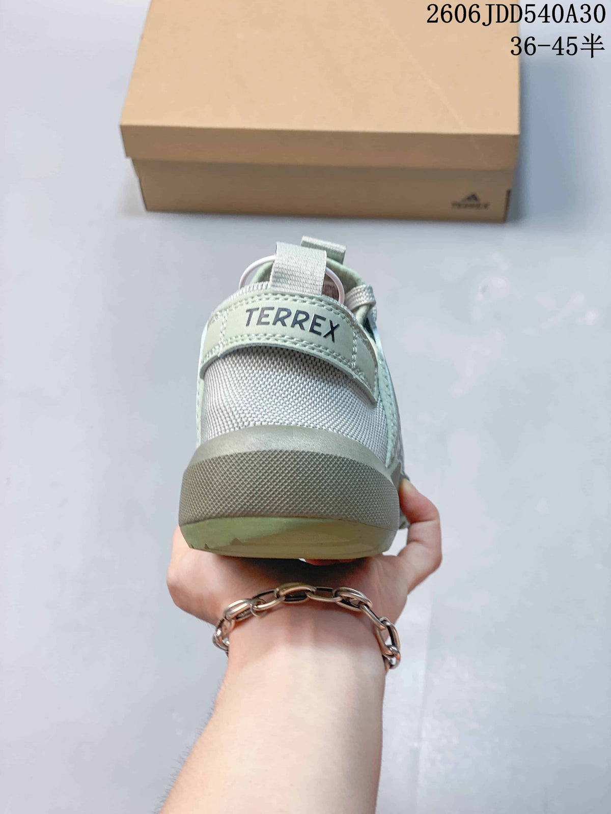 Rear view of the sneaker with a heel pull tab and Terrex branding