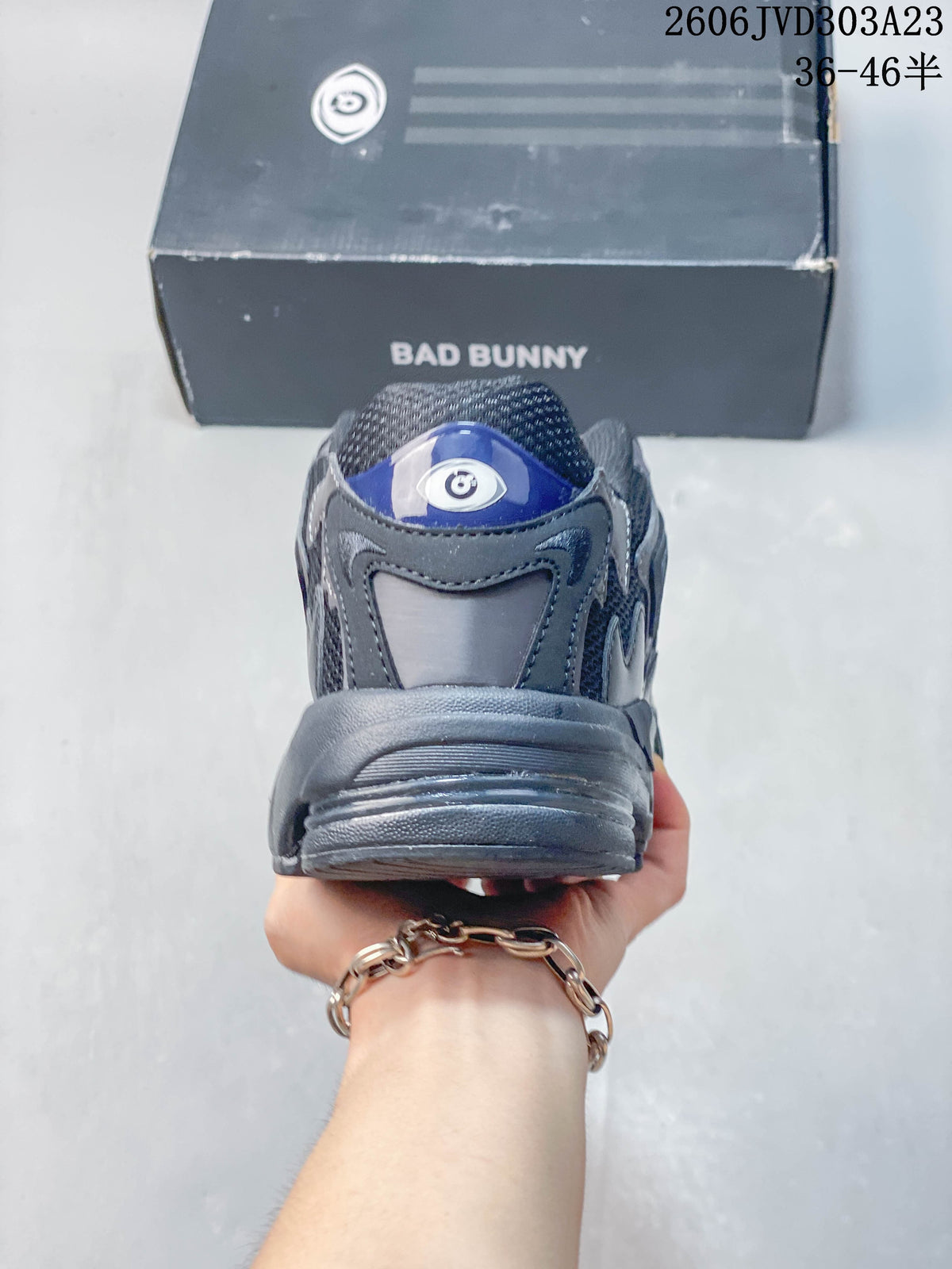 Rear view of a grey adidas Response CL sneaker