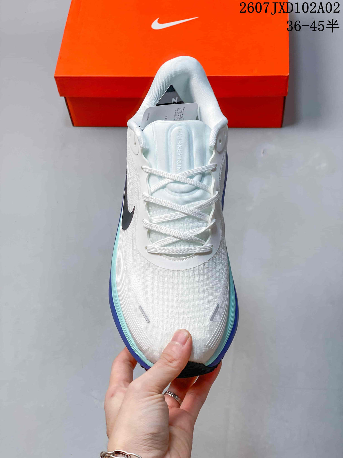 Top view of the shoe showing its white laces and textured upper