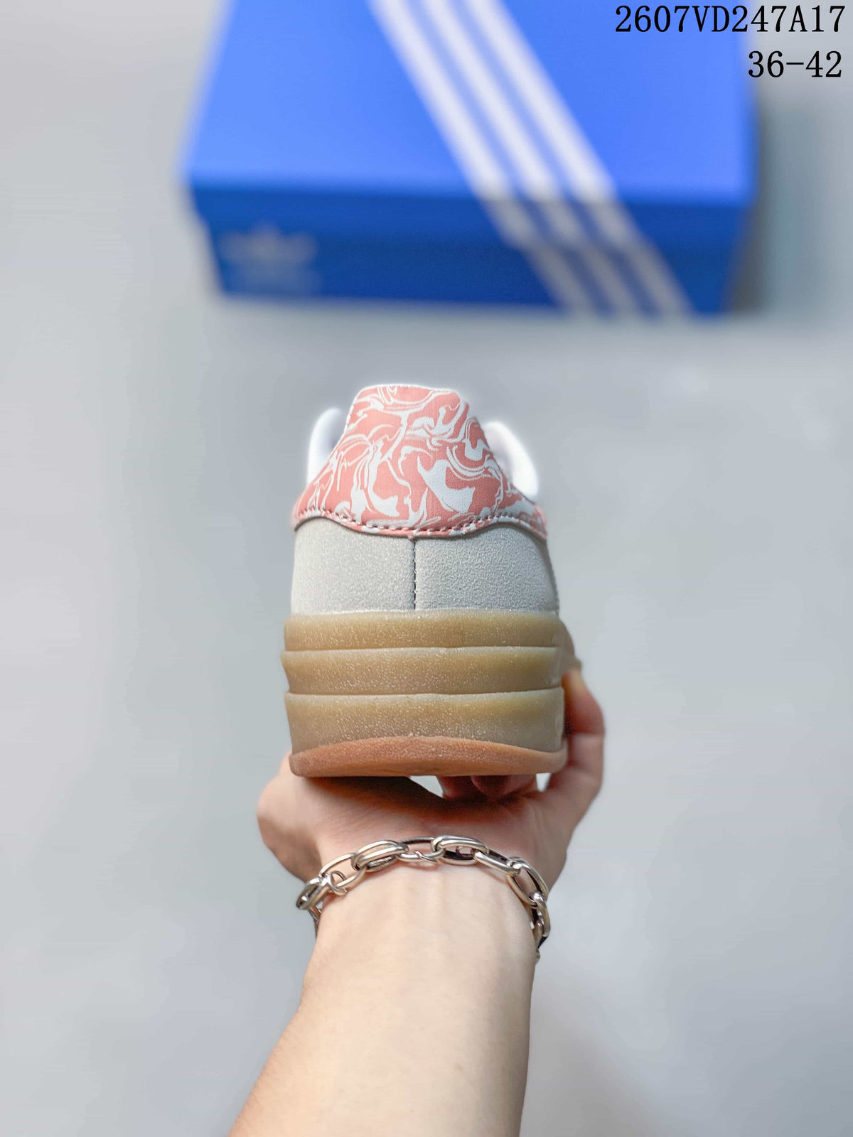 Rear view showing the raised layered platform sole and pink patterned heel detail.