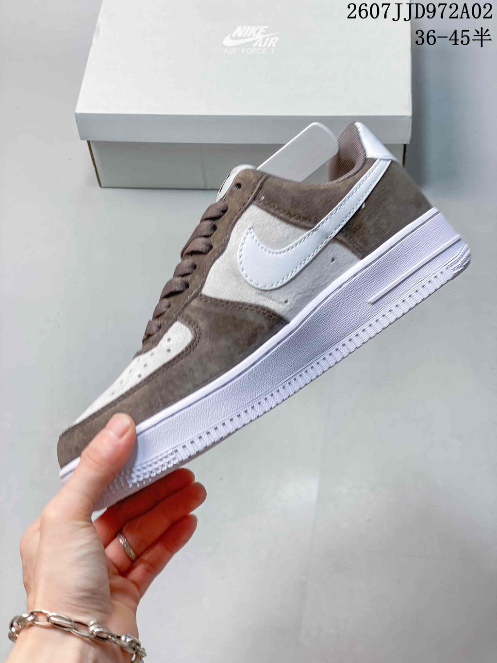 Side profile showing brown and white panels, a white Swoosh and white outsole; image overlay states 36–45.5 and JD972A02.