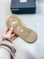 Underside of the sneaker showing a beige ridged outsole