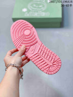 Pink outsole of the sneaker showing circular traction patterns, textured tread, and a Jordan-branded section.