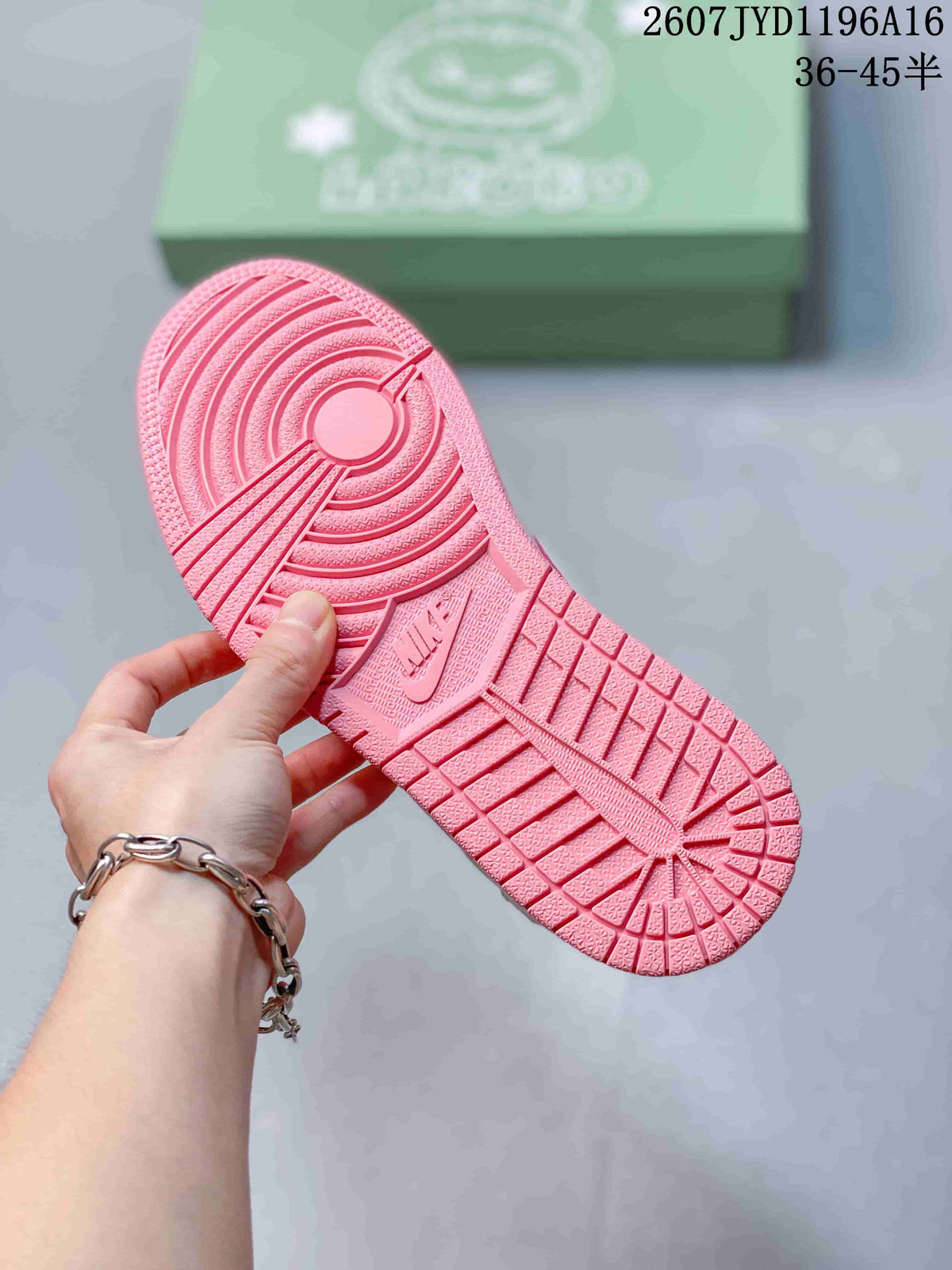 Pink outsole of the sneaker showing circular traction patterns, textured tread, and a Jordan-branded section.