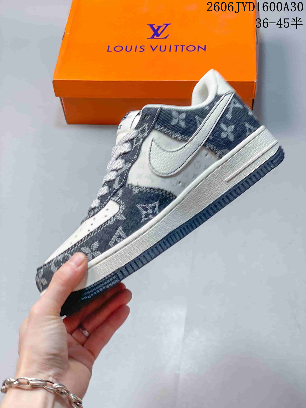 Side view of a low-top sneaker with patterned panels and a light Swoosh