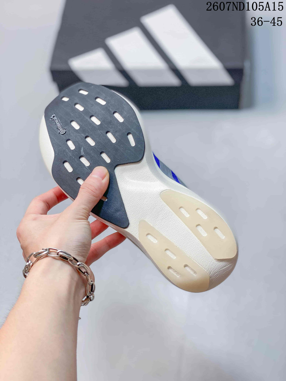 Close view of the sneaker outsole showing dark and light rubber sections with patterned traction grooves.