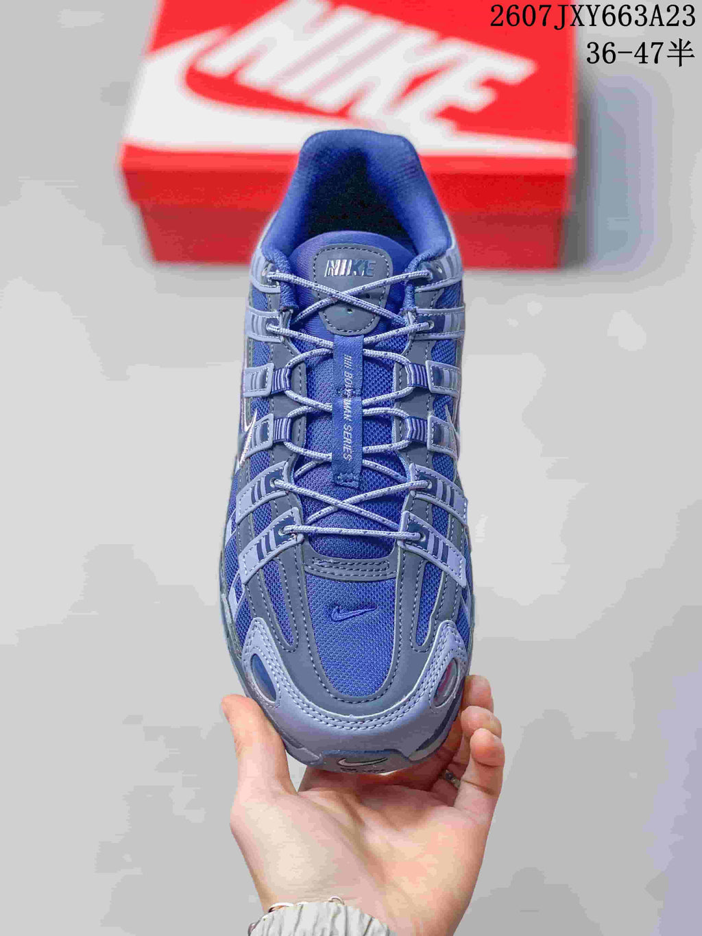 Top view showing the blue mesh upper, gray overlays, laces, and tongue branding