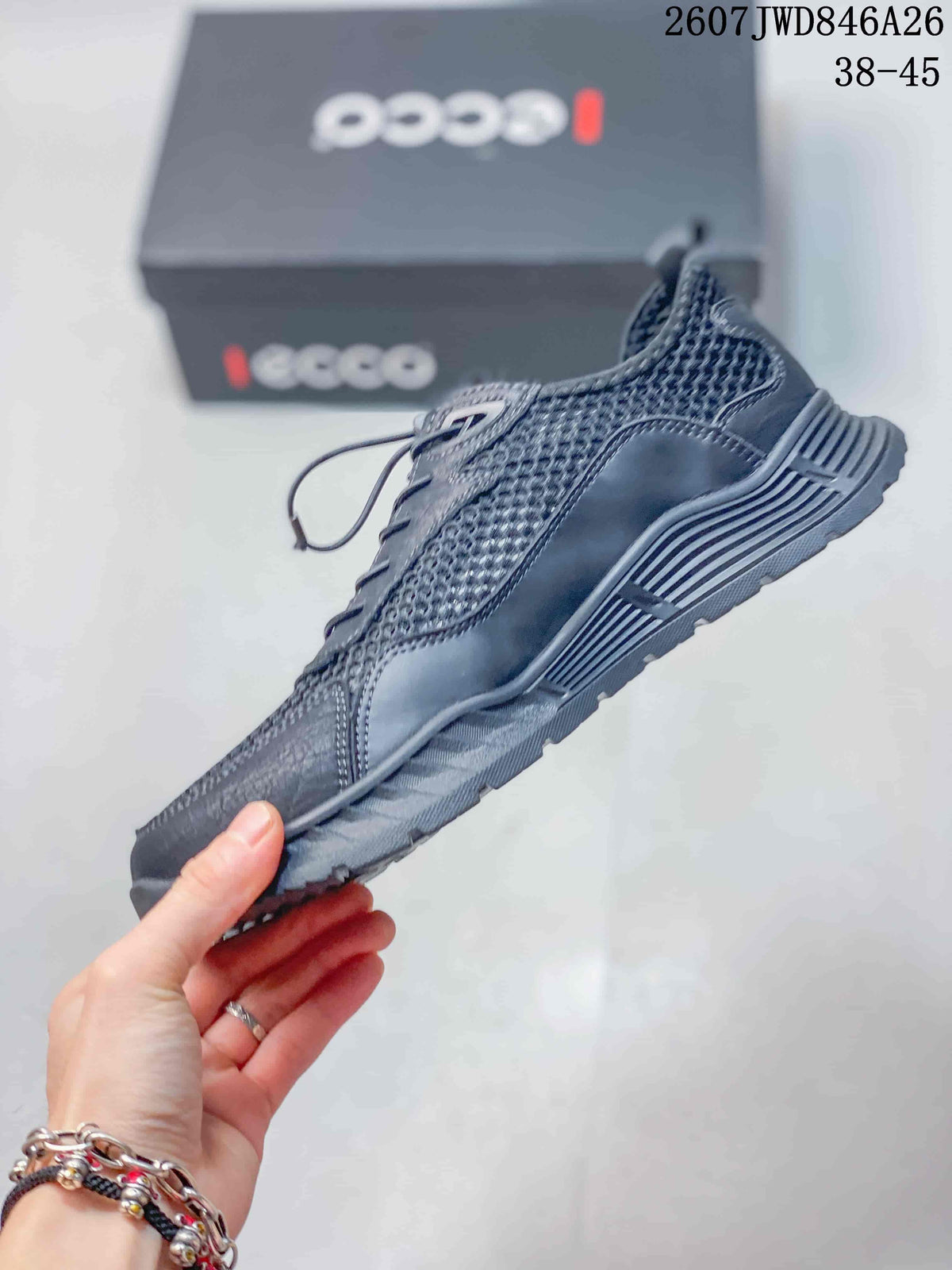 Side profile of a dark gray ECCO lace-up sneaker with mesh panels, structured overlays and a raised heel section.