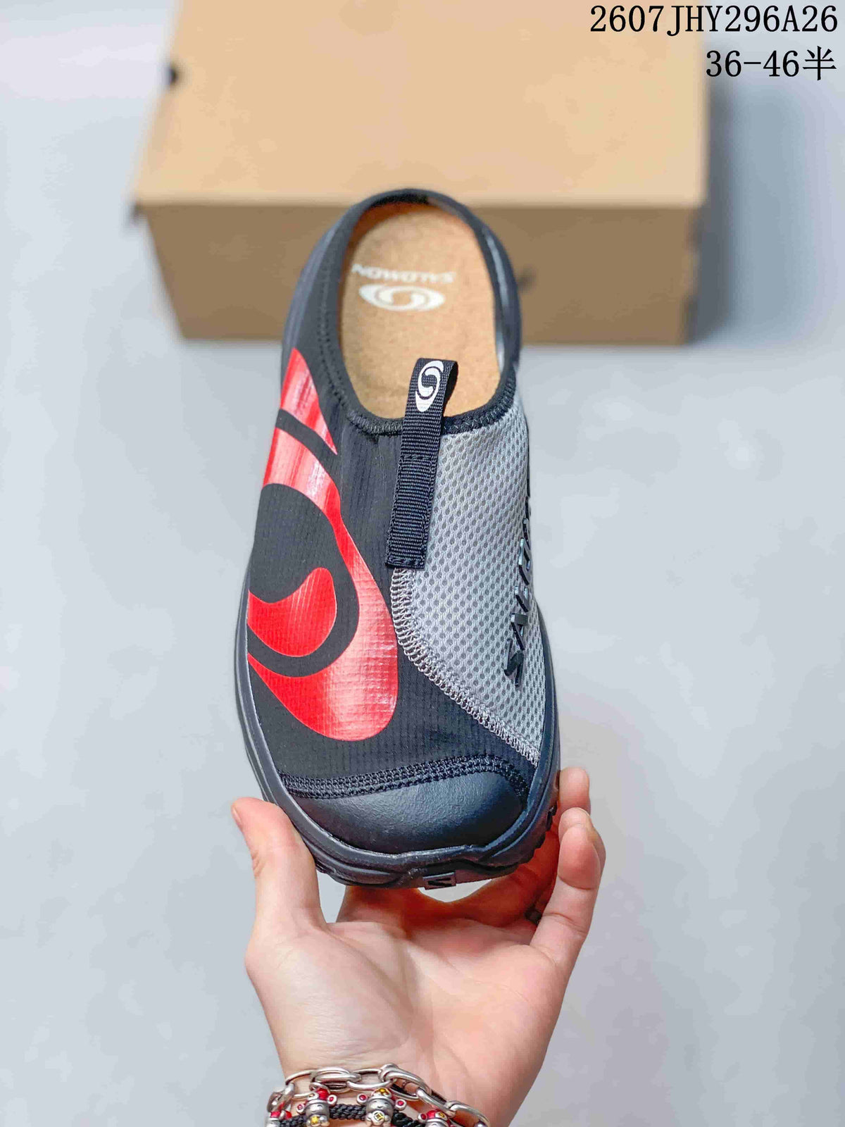 Top view of the closed-toe mule showing the gray mesh panel, front pull tab, black upper, and red graphic detail.