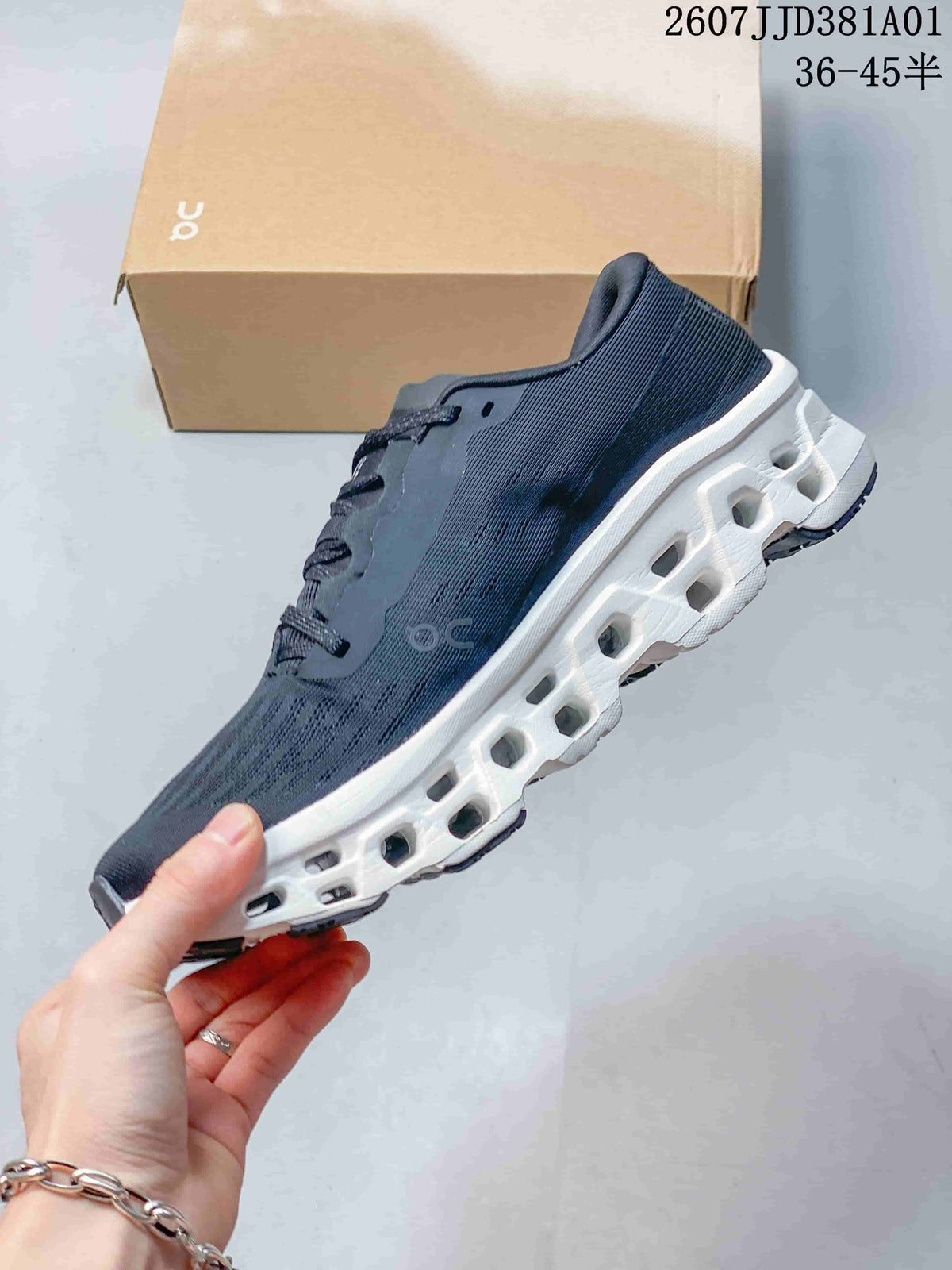 Side view of the dark navy shoe showing its white sculpted sole.