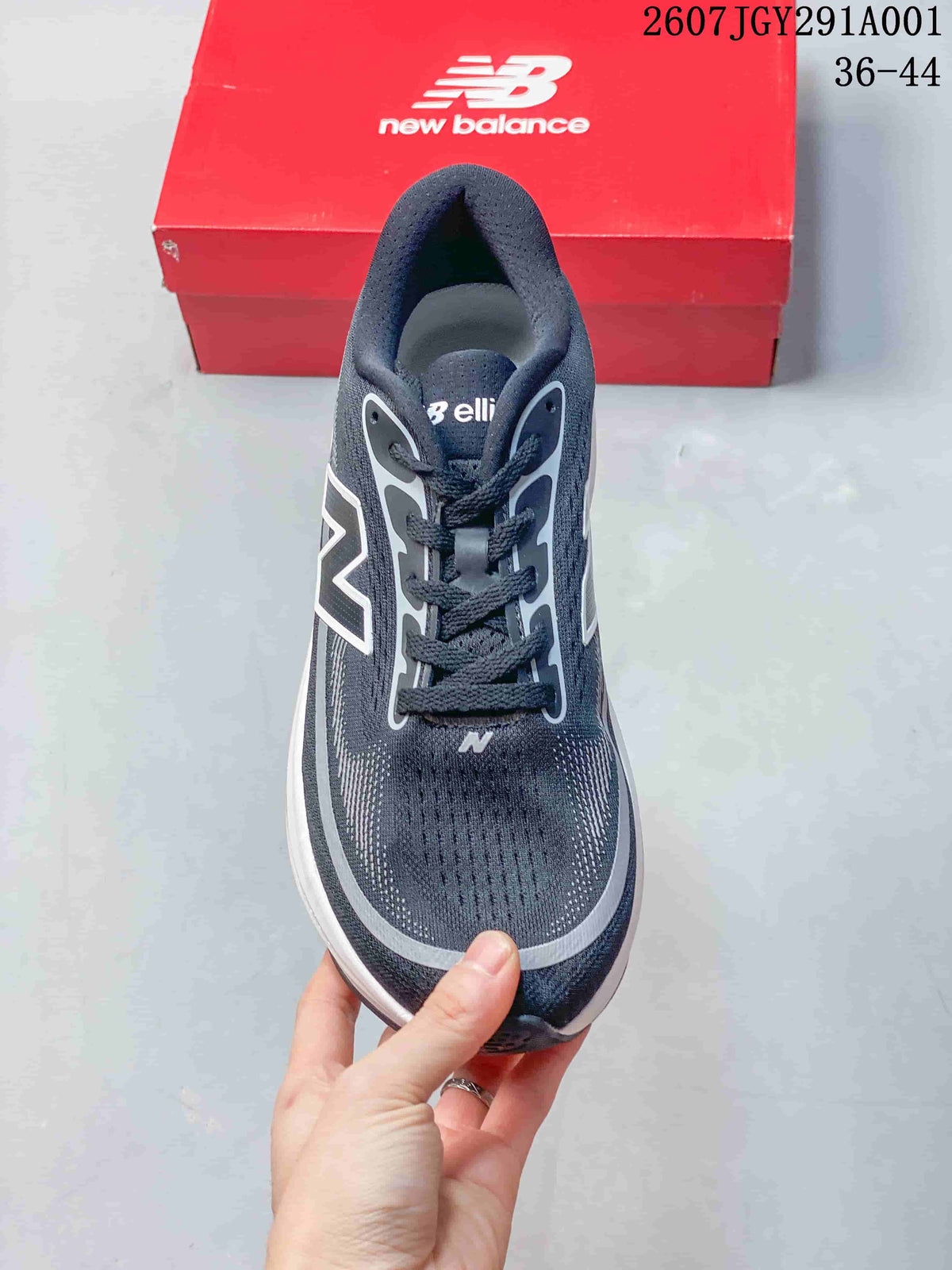Top view of the lace-up shoe showing its dark patterned upper and gray detailing.