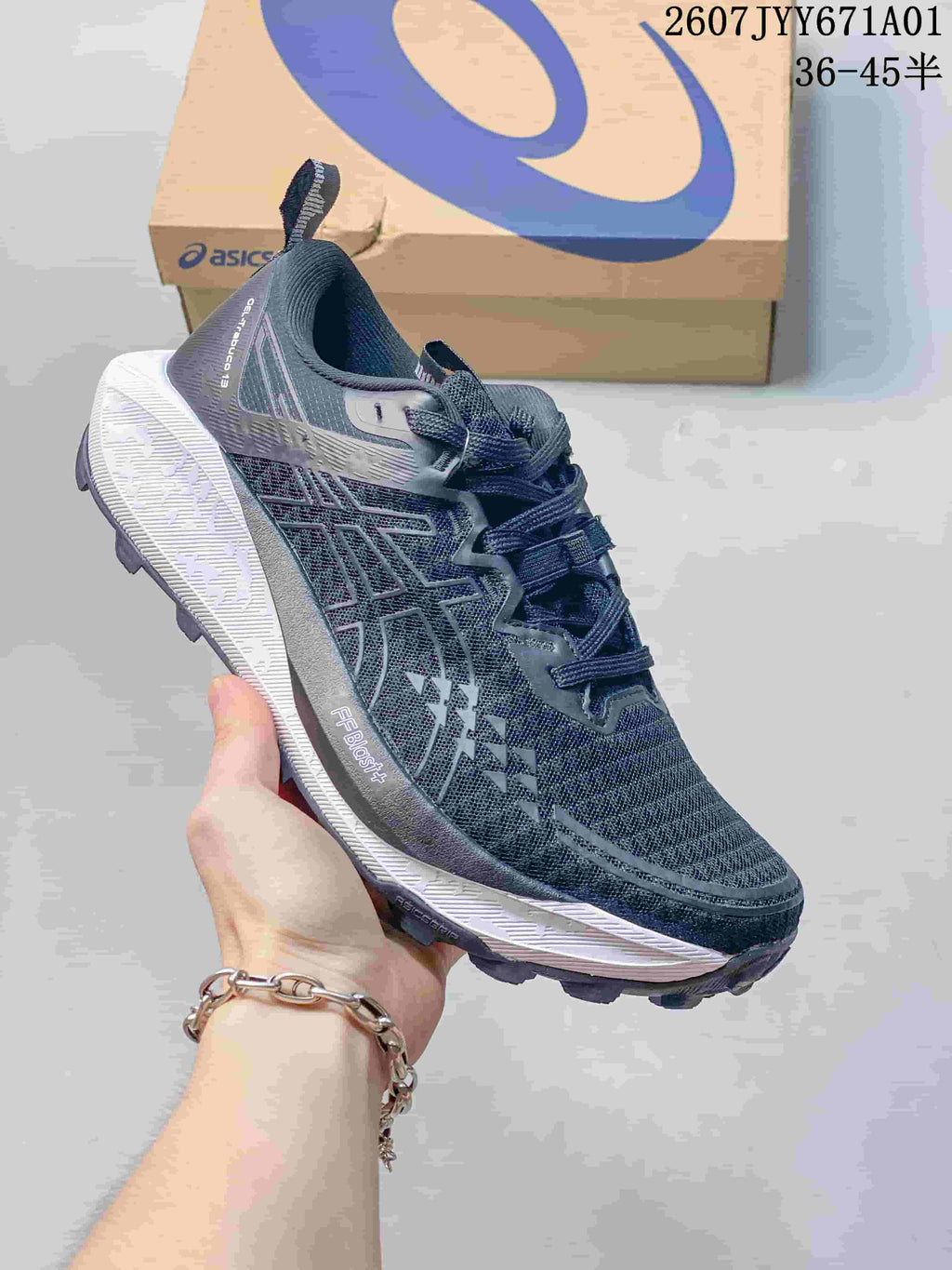 Dark navy ASICS GEL-TRABUCO 13 trail shoe with a light-colored midsole