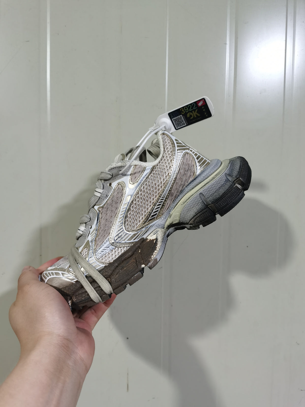 Opposite angled view showing the layered upper, mesh-style panels, laces, and contrasting outsole.