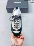 Top view of the sneaker showing the rounded toe, contrasting lace panel, and patterned laces.