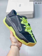 Navy sneaker with neon yellow-green laces and sole accents.