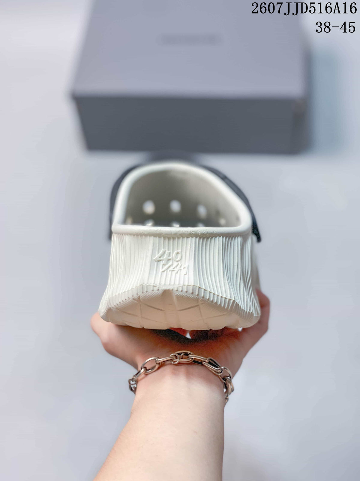 Rear view of the clog sandal showing the closed heel, ventilation openings, and embossed branding.