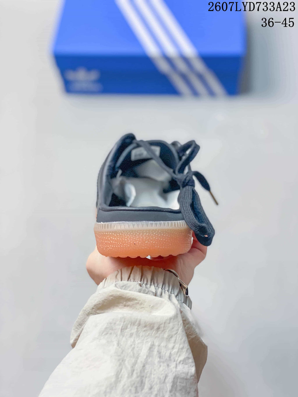 Rear view showing the open-heel mule construction and gum outsole