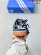 Rear view showing the open-heel mule construction and gum outsole