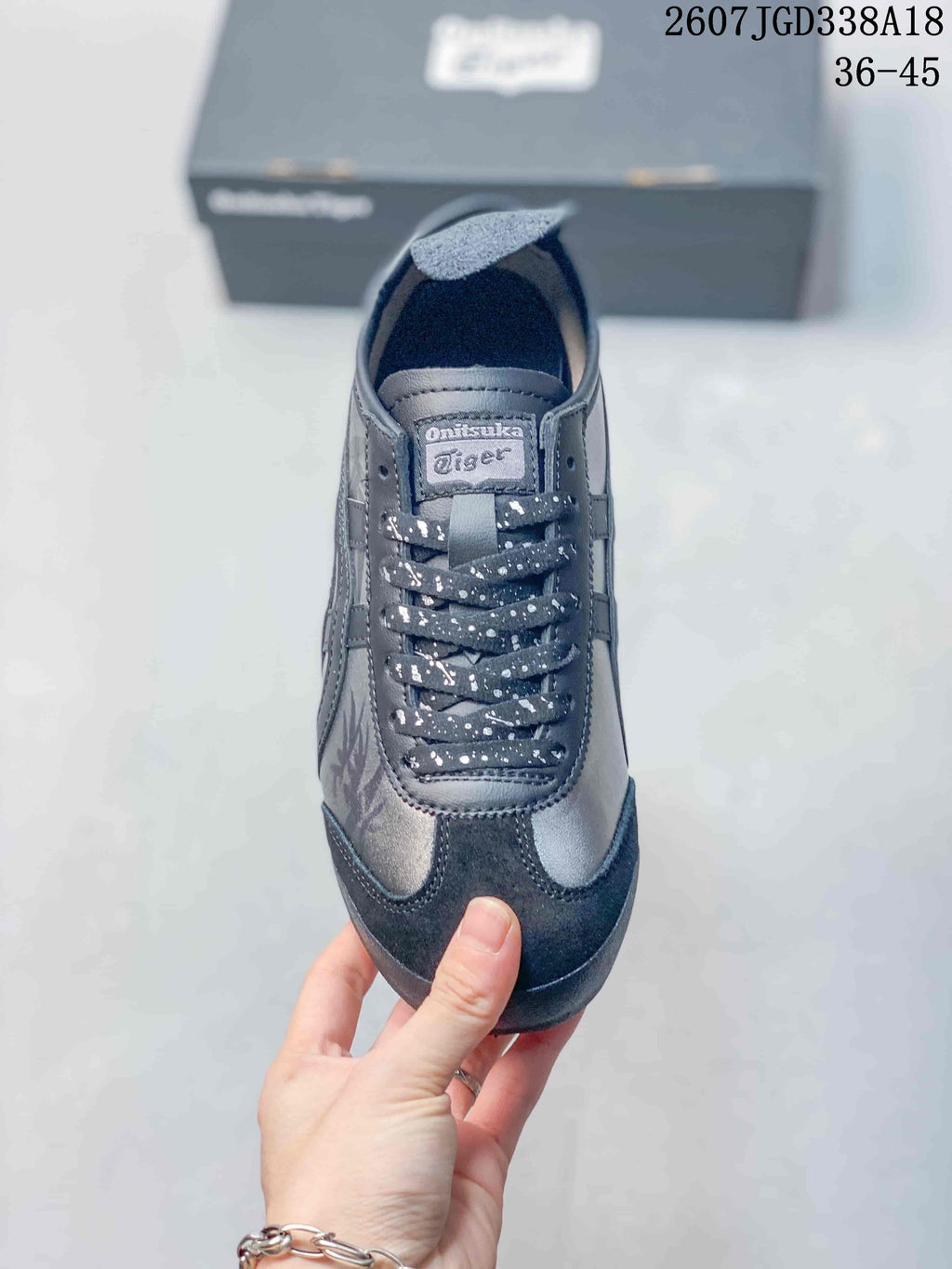 Top view showing the tongue label, patterned laces, and dark toe overlay.