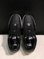 Top view showing the perforated toe boxes, black laces, and padded collars.