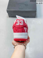 Heel view showing a number 33 detail on a red patterned sneaker