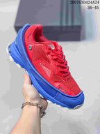 Close-up of a red and blue OZWEEGO sneaker with matching red laces and layered side panels.