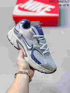 White and blue Nike V5 RNR sneaker shown from an angled front view.