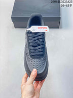 Top view showing the perforated toe box, lace-up fastening, padded tongue, and attached security tag.