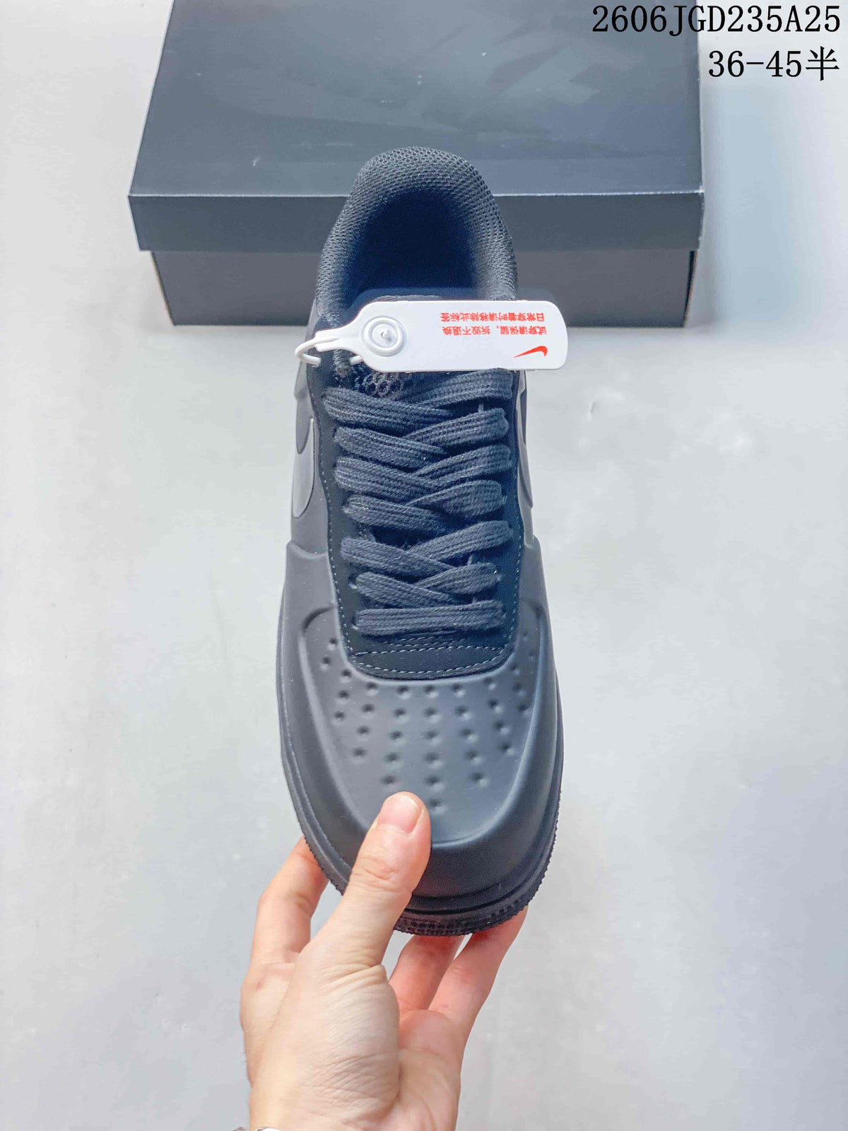 Top view showing the perforated toe box, lace-up fastening, padded tongue, and attached security tag.