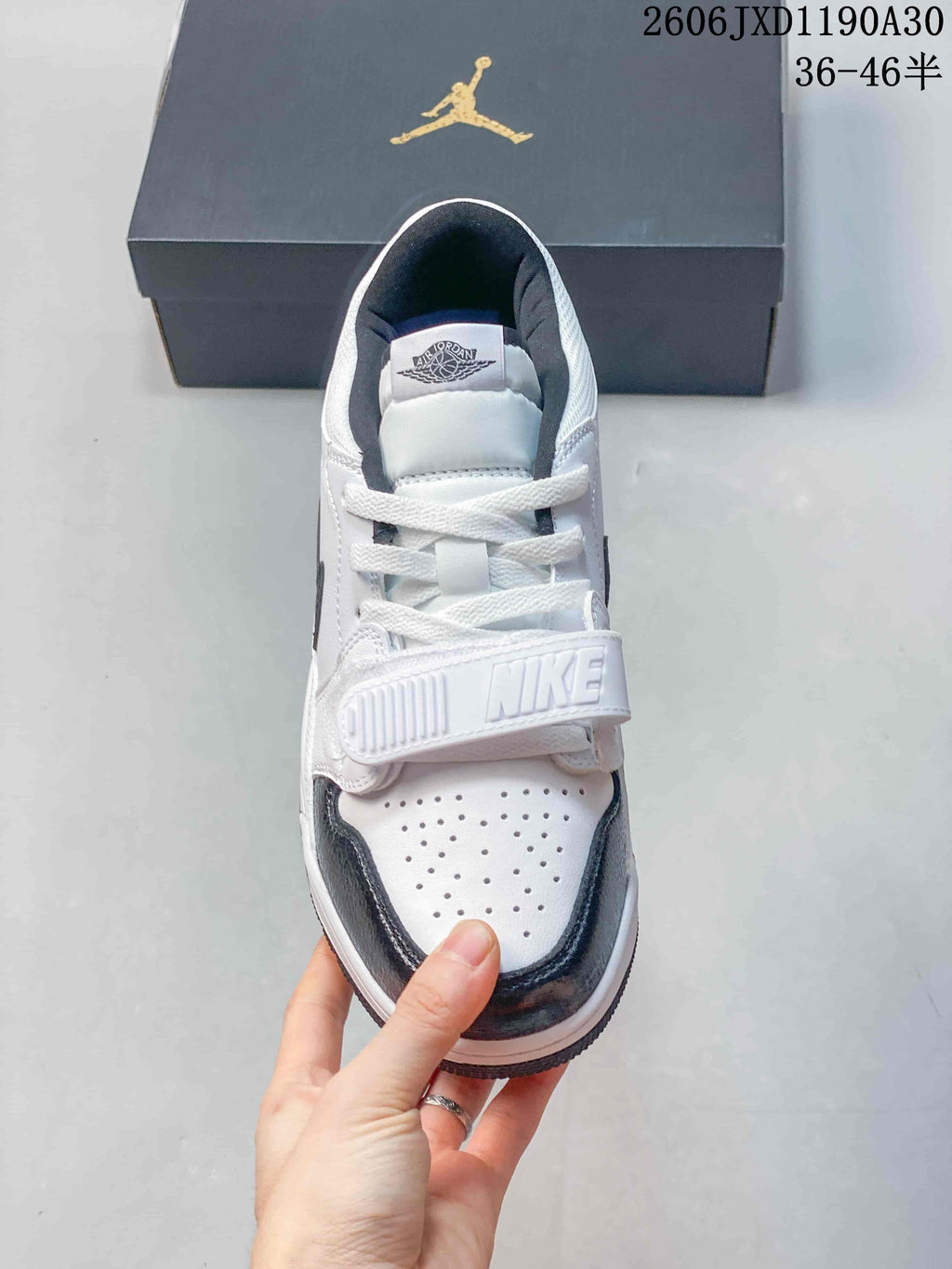 Front view of a Jordan Legacy 312 Low with perforated toe and lace strap