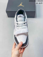 Front view of a Jordan Legacy 312 Low with perforated toe and lace strap