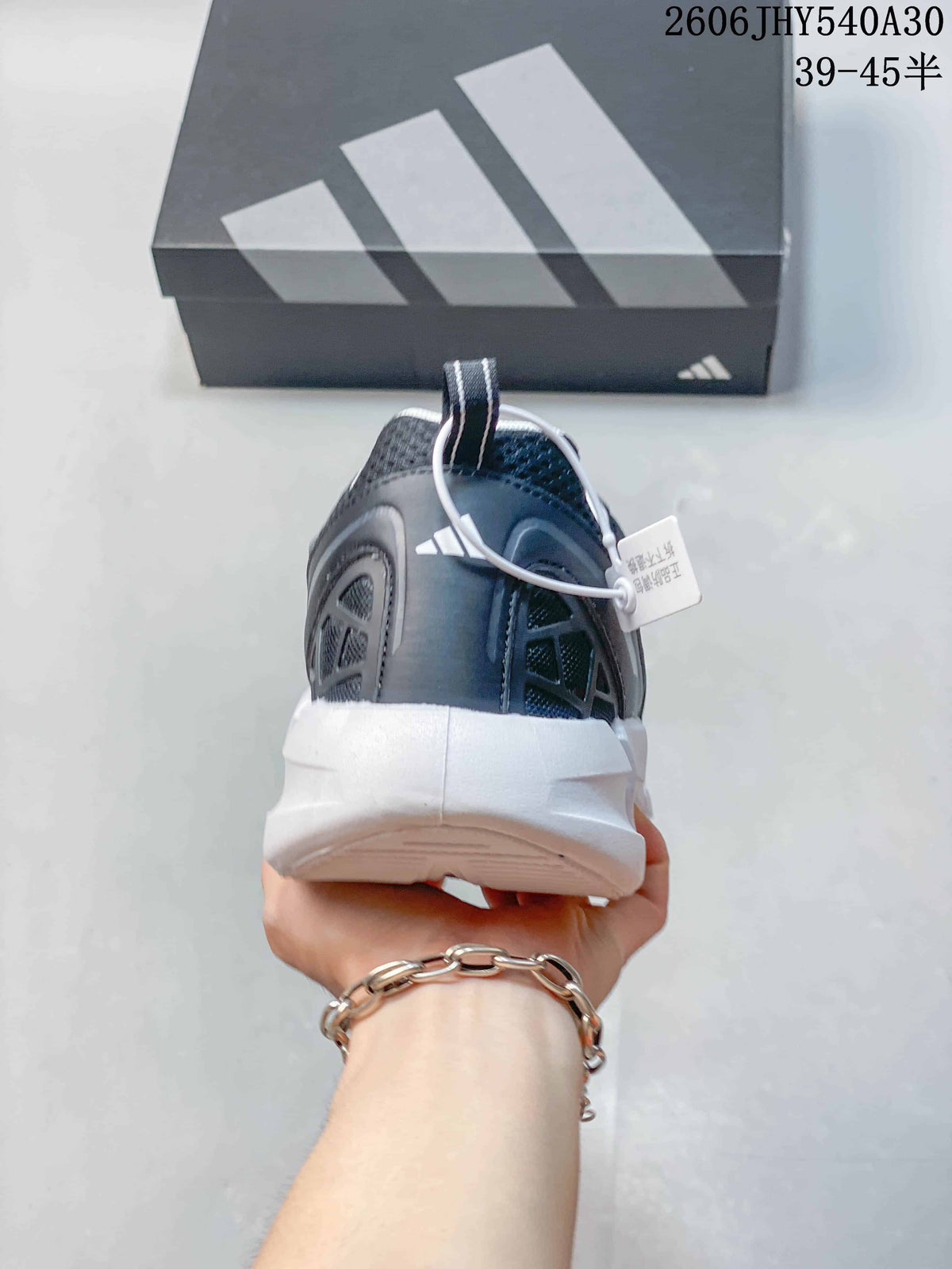 Rear view showing the heel, mesh panels, and thick white sole.