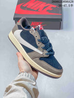 Angled side view of the navy and taupe low-top sneaker with a light-colored reverse Swoosh