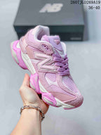 Three-quarter side view of the pink and lilac New Balance 9060 sneaker with layered panels and a chunky outsole.