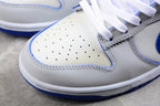 Close-up of the perforated white toe box and layered panel stitching.