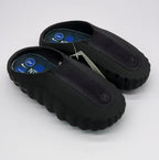 Top three-quarter view of the pair showing the open heel, textured uppers and blue footbed graphics.