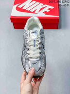 Top view of a silver-toned Nike P-6000 sneaker with lace-up closure