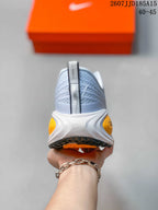Rear view showing the textured heel area, layered midsole, and contrasting outsole.