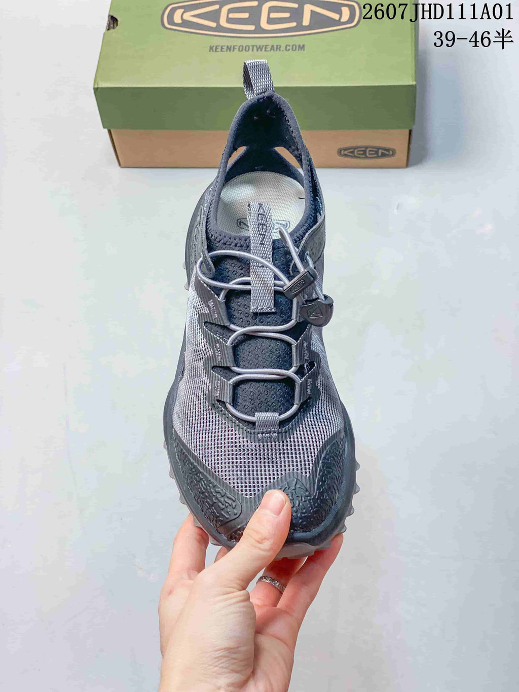Front view showing the cord-toggle lacing and protective toe overlay