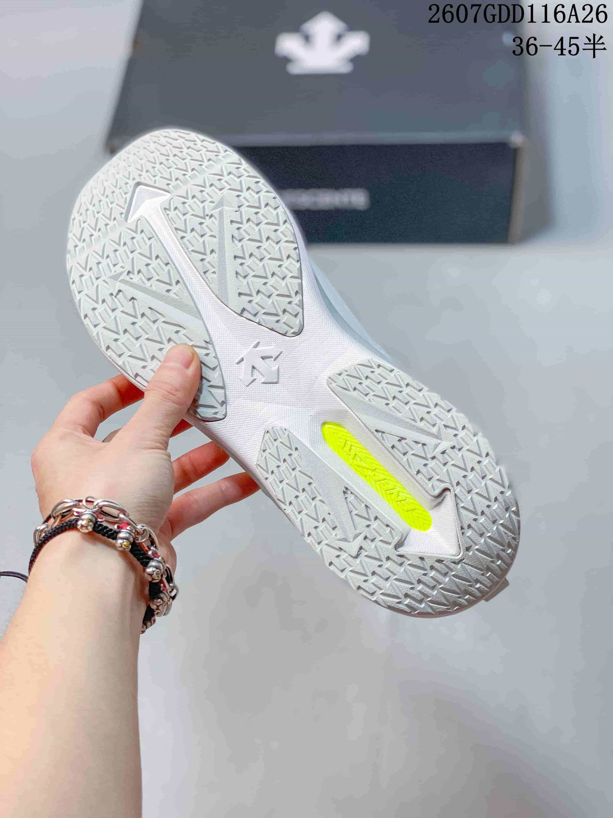 Close view of the patterned white outsole with a contrasting lime-green inset section.