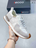 Angled side view showing the sneaker’s panels, heel detail, and gum outsole
