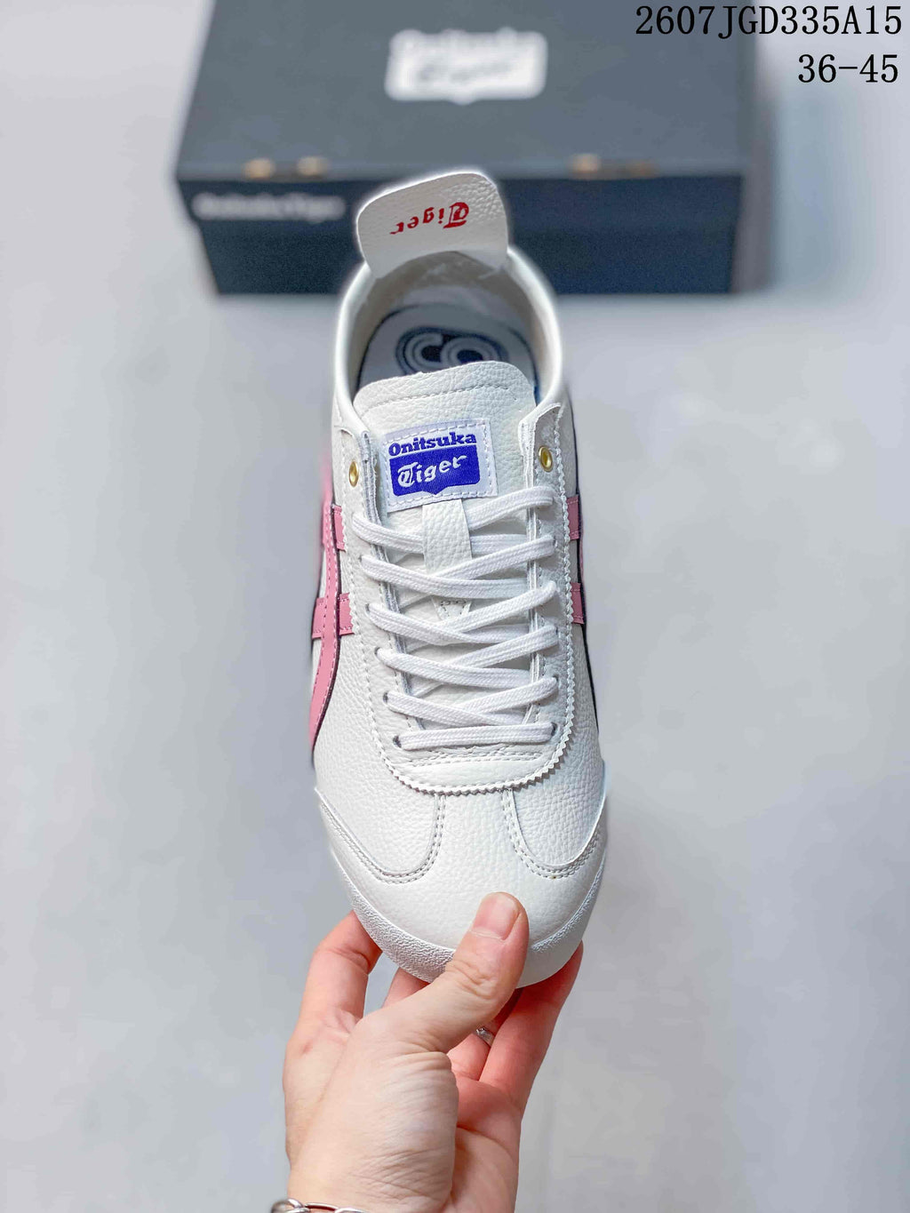 Top view showing the white lace-up sneaker, blue Onitsuka Tiger tongue label and rounded toe.