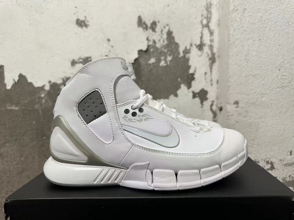 Side view of a white Nike Zoom Kobe 2K5 FTB shoe with gray accents and perforated panels.