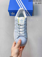 Front view showing the shell-toe design and lace-up fastening