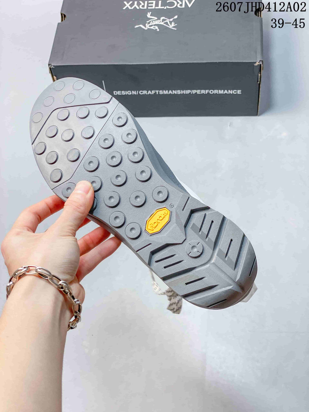 Close-up of the shoe's gray lugged outsole