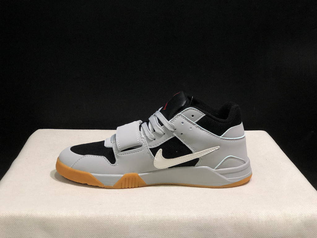 Full lateral view of one sneaker showing the side Swoosh, layered white panels, and gum-colored outsole.