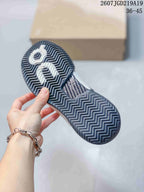Underside view of a shoe showing the dark outsole and its herringbone-like tread pattern; style code 2607TGD219A19 and size range 36-45 are visible.