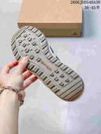 Close-up of the patterned outsole on an Adidas Terrex Daroga 25 sneaker