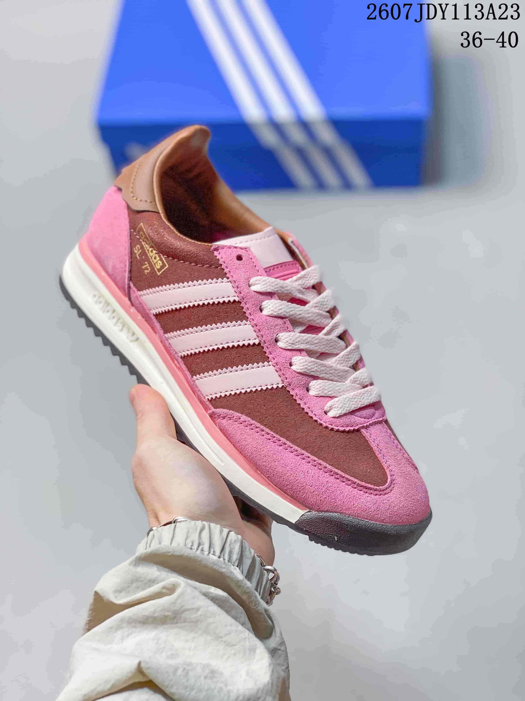 Pink and brown adidas SL 72 sneaker with white laces, white side stripes and a dark toe outsole.