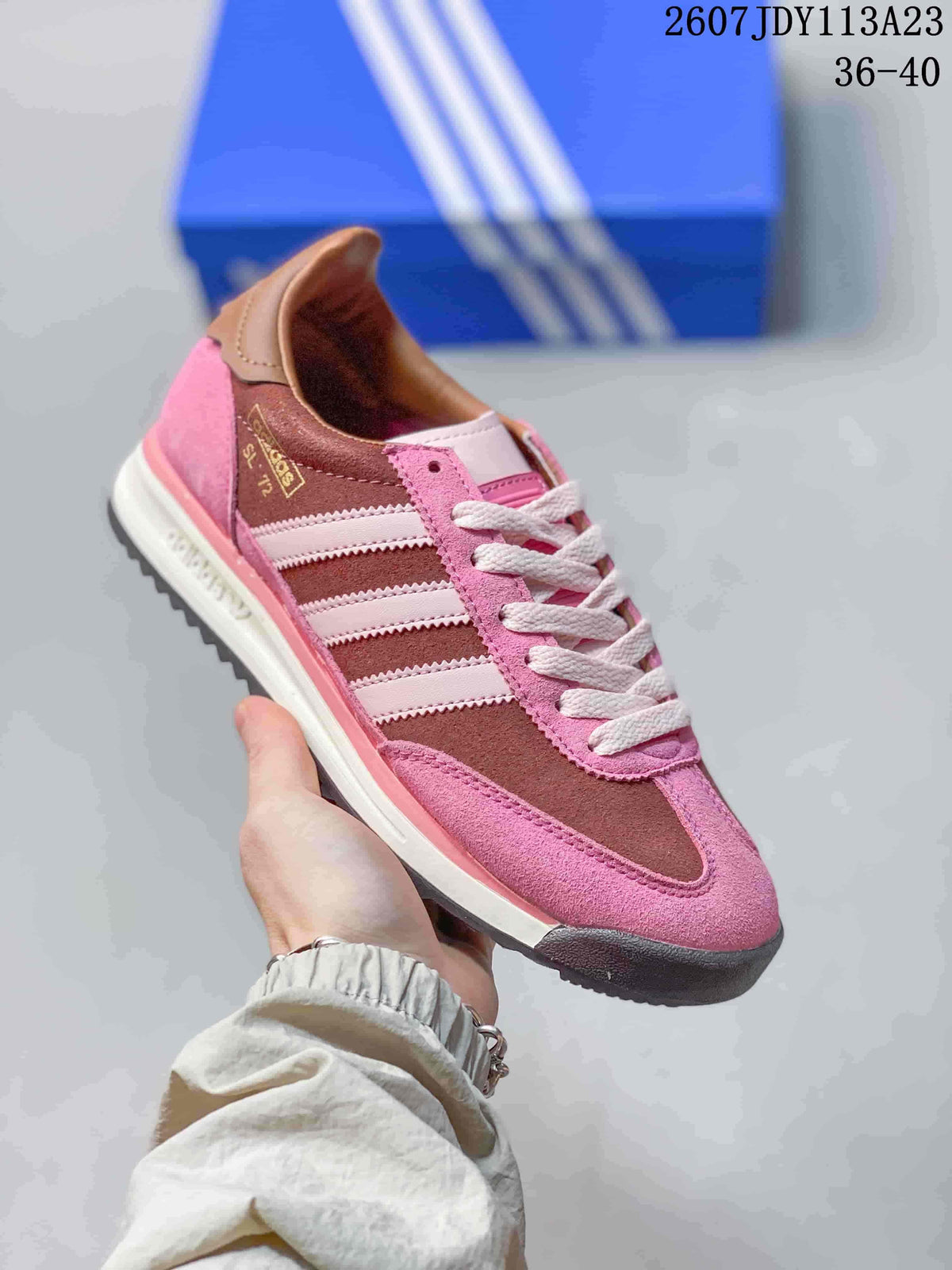 Pink and brown adidas SL 72 sneaker with white laces, white side stripes and a dark toe outsole.